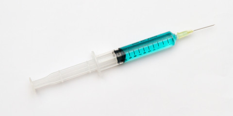 Blue vaccine in syringes.