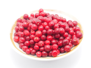 cranberries in a bowl on a white background