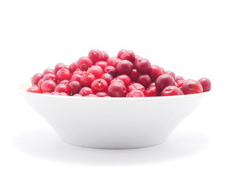 cranberries in a bowl on a white background
