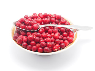 cranberries in a bowl on a white background