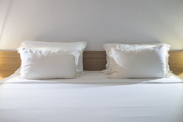 Fototapeta na wymiar white pillows on a modern bedroom