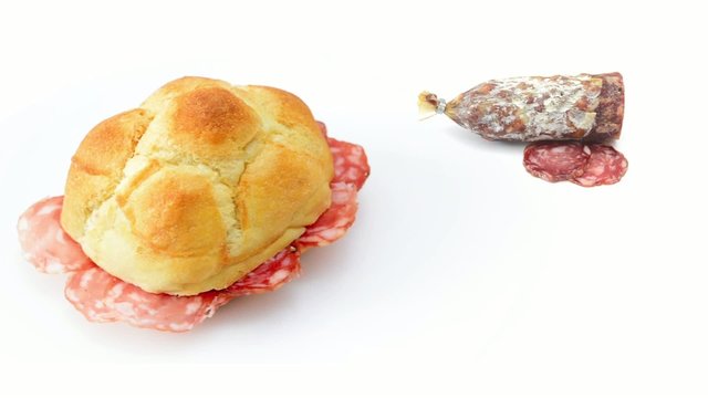 roll with salami rotating on white background