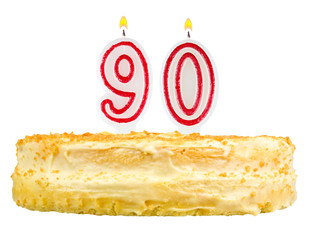 birthday cake with candles number ninety isolated on white