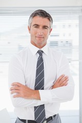 Fototapeta premium Serious businessman with folded arms