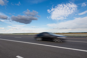 Fast blurred car in the freeway.