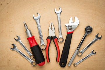 Set of hand tools on a wooden panel