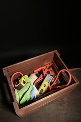 Wooden box with different tools,