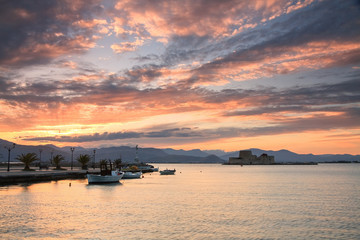 Fototapeta na wymiar Sunset in the fishing harbour in Nafplio, Greece.