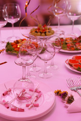 Buffet table with dishware waiting for guests