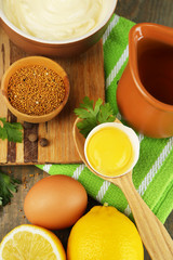 Mayonnaise ingredients on wooden background