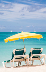Green Chairs Under Yellow Umbrella in Paradise
