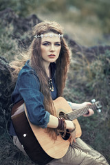 Fototapeta na wymiar Beautiful hippie girl with guitar