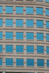 Square Blue Windows on Ornate Stone Building
