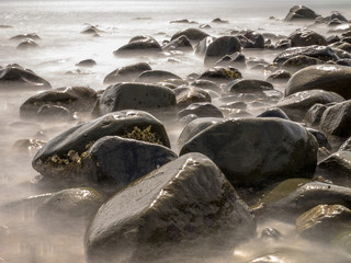 Stones in Blurred Water by Long Exposure