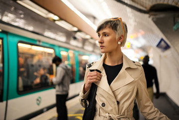 Businesswoman portrait inside metro subway. Paris, France.