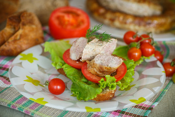 sandwich with tomatoes and homemade sausage