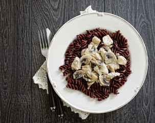Chocolate pasta on a white plate