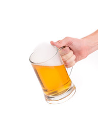 Hand holding beer glass.
