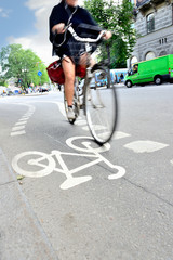 Naklejka premium Motion blurred woman on bike