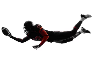Foto op Plexiglas american football player scoring touchdown silhouette © snaptitude