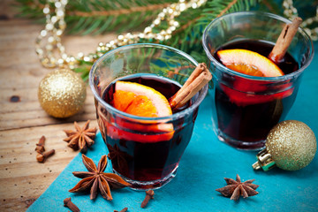 Mulled wine and spices with christmas decorations