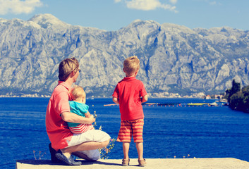 father and kids travel on sea vacation