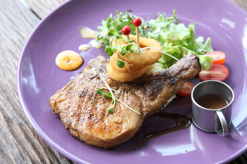 Grilled Porkchop on wood background