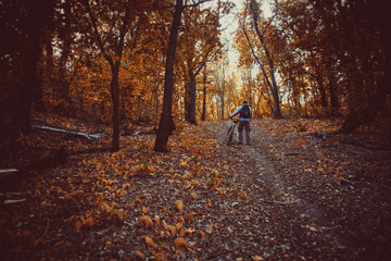 Fototapeta premium Man with bike in forest
