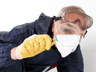 Exterminator at work with magnifier