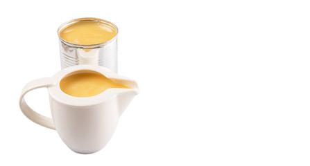 Condensed milk in tin can and milk pitcher
