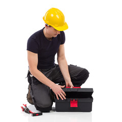 Repairman opening a toolbox