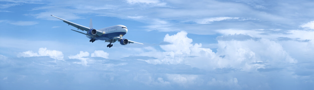 Fototapeta Jet plane in a cloudy sky