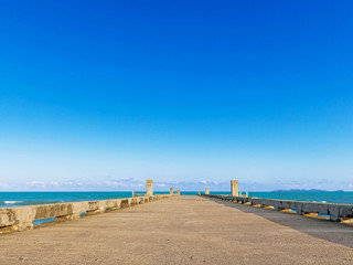 Dock with beach on summer
