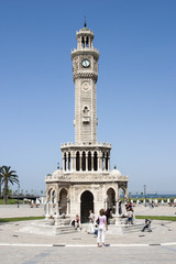 People arround Konak clock tower in Konak square of Izmir