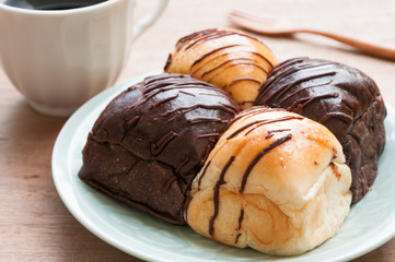 Freshly baked two- color bread loaf with cup of coffee