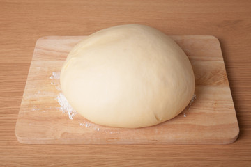 dough on a board with flour.