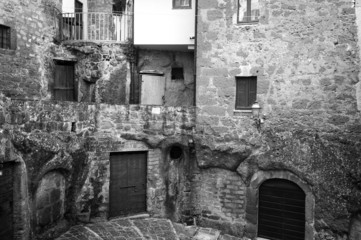 Pitigliano, Tuscany, old city center view. BW image