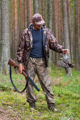 hunter with hazel grouse