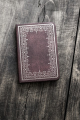 Old notebook on old wooden background