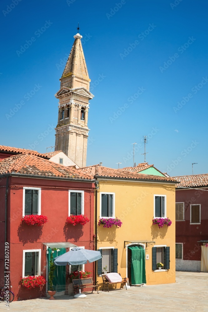 Wall mural Colorful buildings and leaning bell tower in Burano Venice