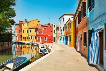 Fototapeta na wymiar colorful houses by the water canal at the island Burano Venice