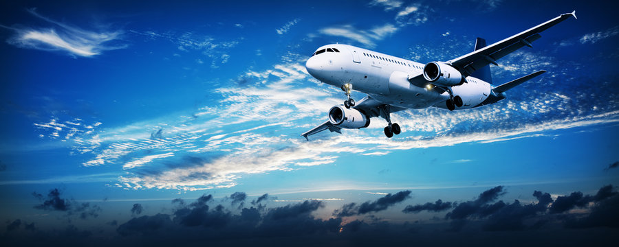 Fototapeta Jet in a sunset sky