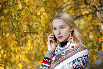 Portrait of a beautiful young woman calling by phone