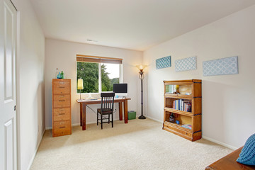 Office interior with simple desk and bookshelf