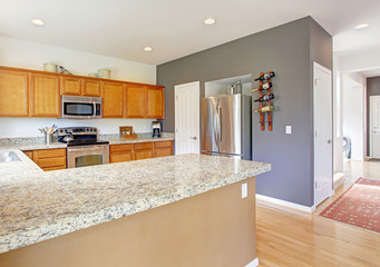 Kitchen room with granite tops and steel appliances