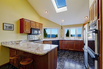 Beautiful kitchen room with skylight granite tile floor