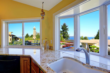 Kitchen cabinet with granite tops and beautiful window view