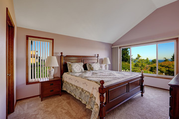 Master bedroom interior in light pink color with scenic windown