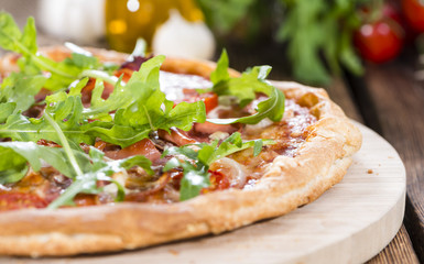 Ham Pizza with rocket and fresh tomatoes