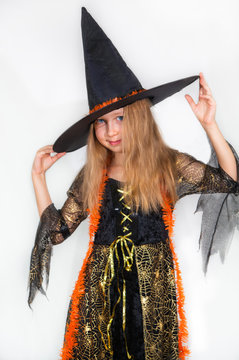 Girl posing in witch dress